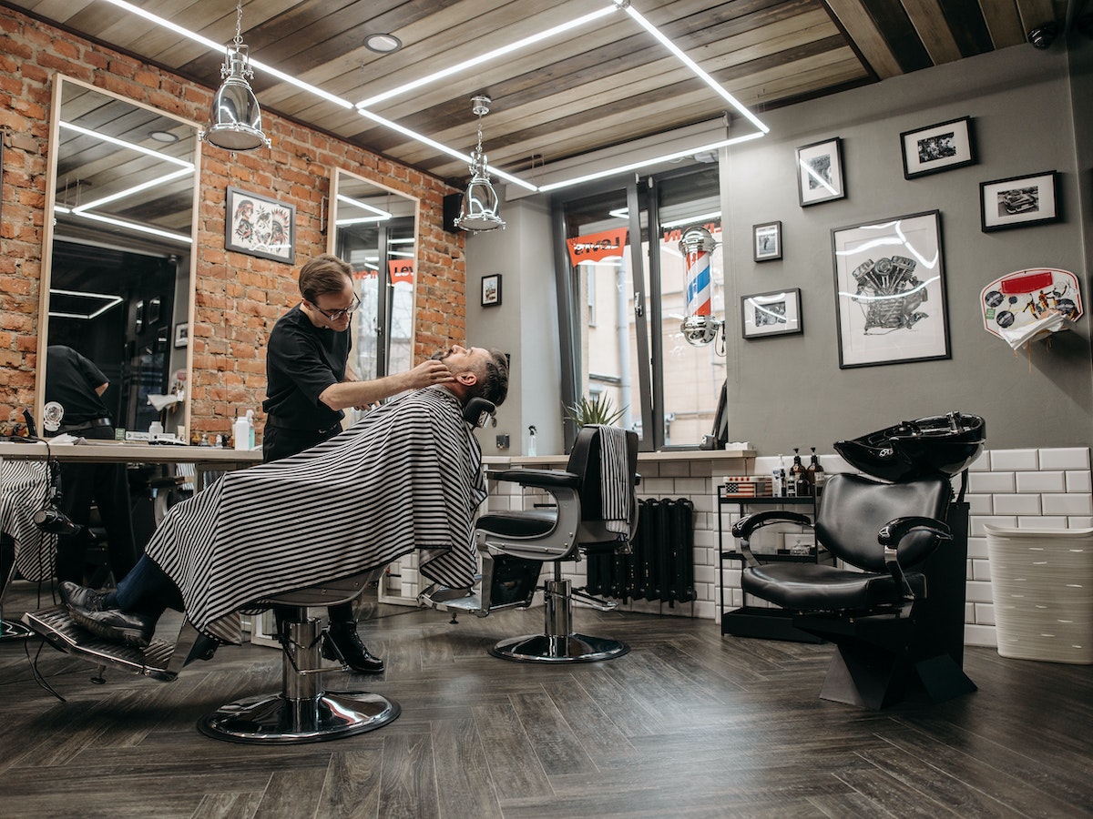 Customers In Local Barber Shop Stock Photo - Download Image Now